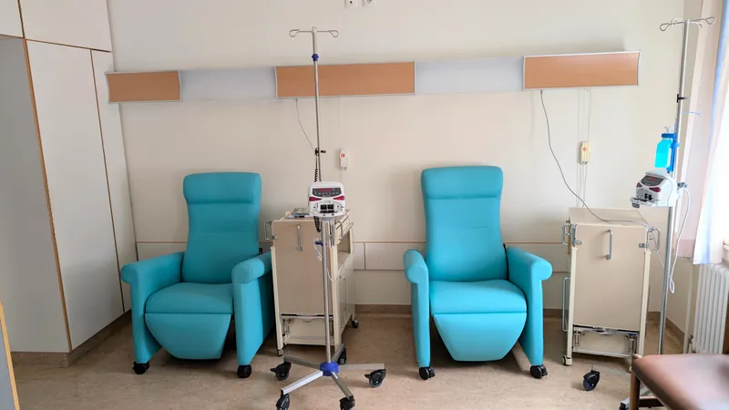 Clinical treatment room with recliner chairs and IV equipment for recurring dialysis appointments